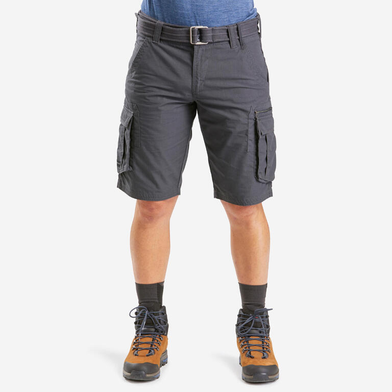 Men's grey trekking cargo shorts with multiple utility pockets and a belt, worn with hiking boots