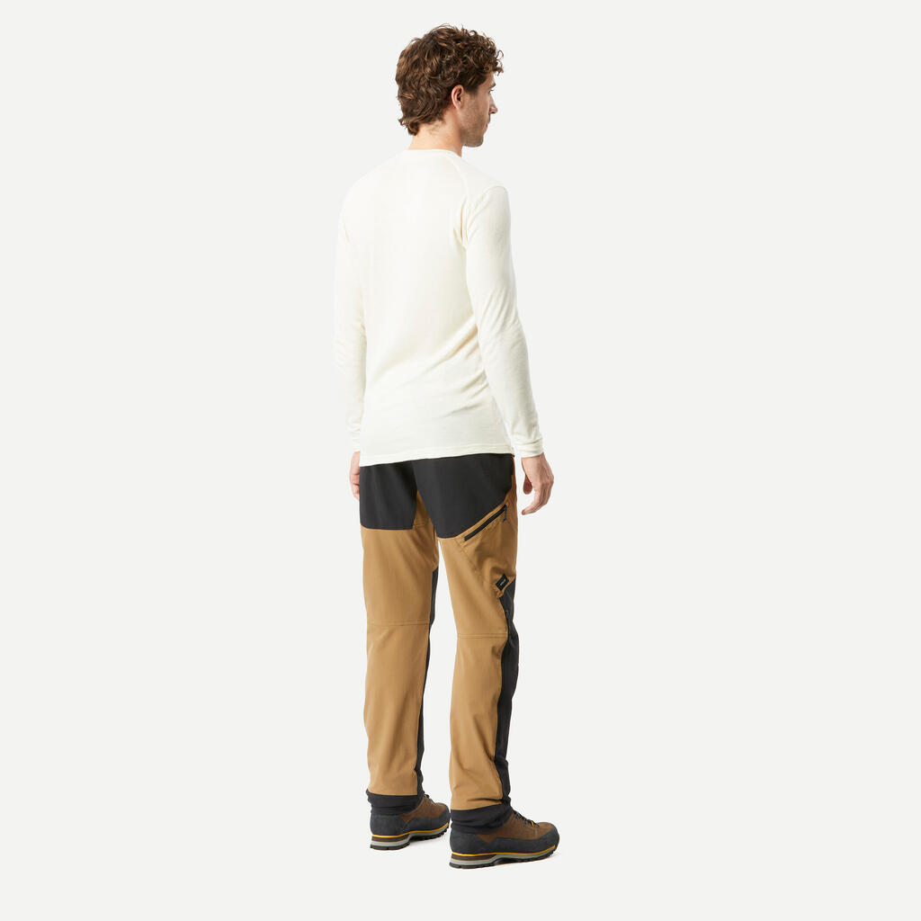 Pantalón de trekking en montaña perlante y rompevientos para hombre MT900