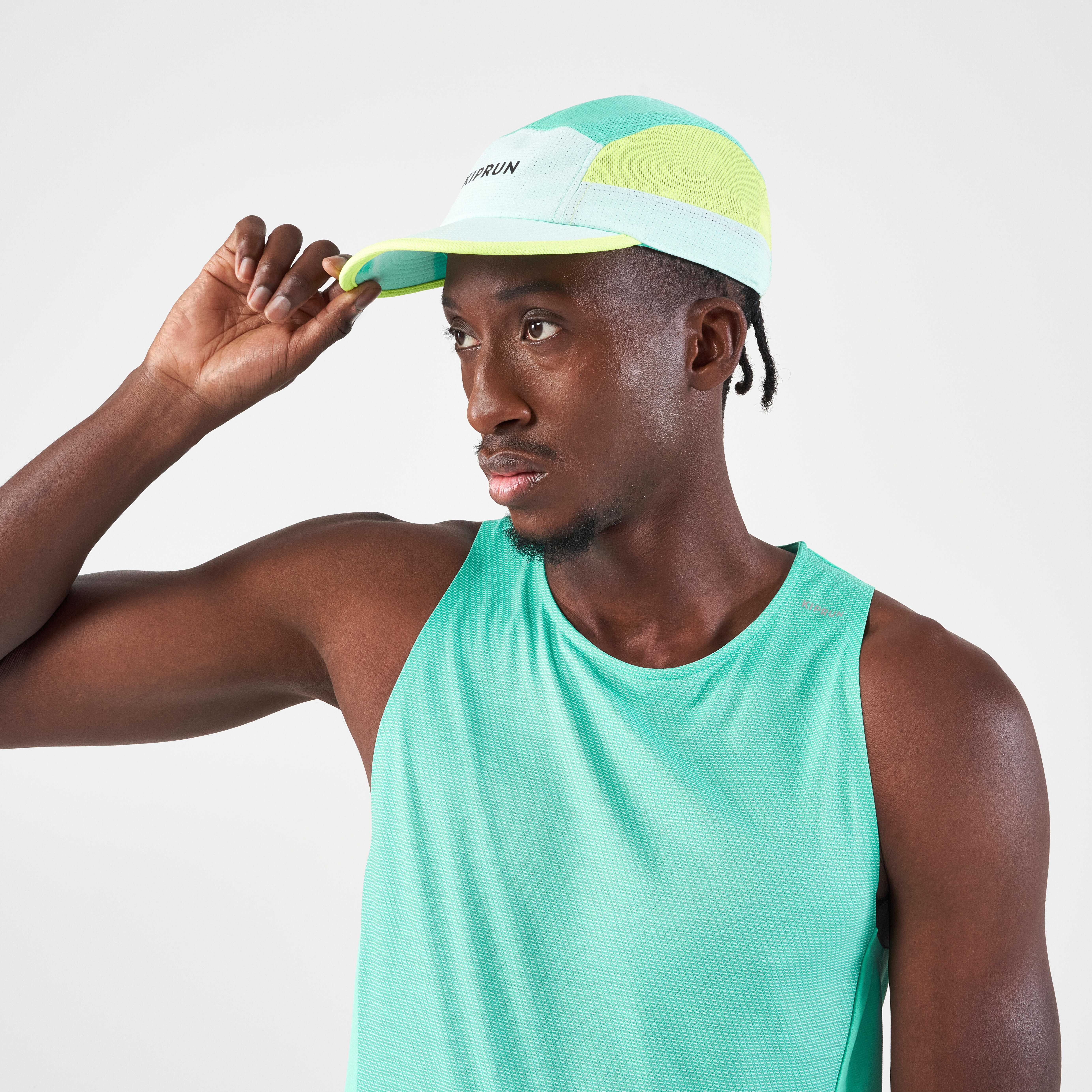 JOCKEY DE RUNNING UNISEX - KIPRUN 5 PIEZAS TURQUESA AMARILLO