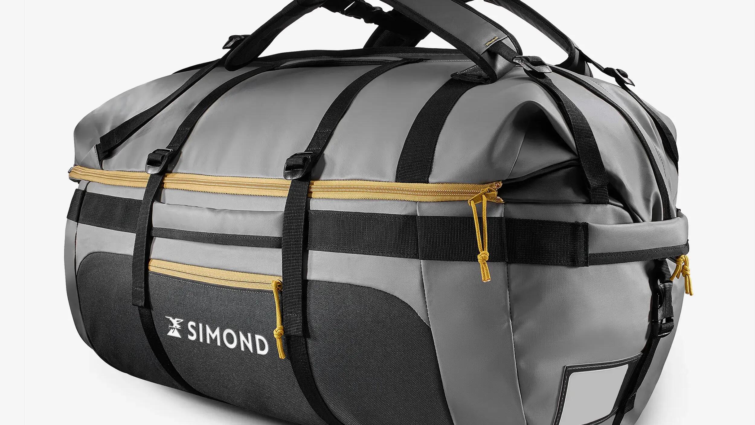 Een grijze Extend 80/120L-tas voor trekking repareren