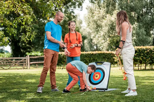 Image of 3 persons using stand-up paddles