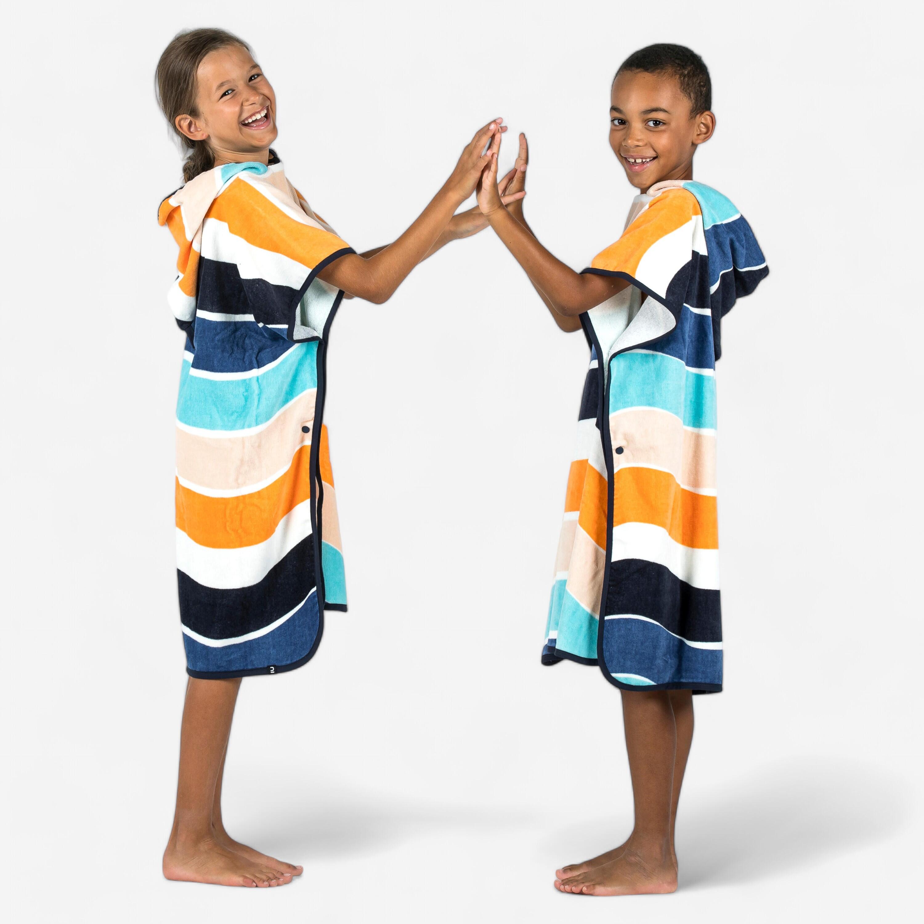 Children's surf poncho 110 to 135 cm - 500 Wavy orange blue