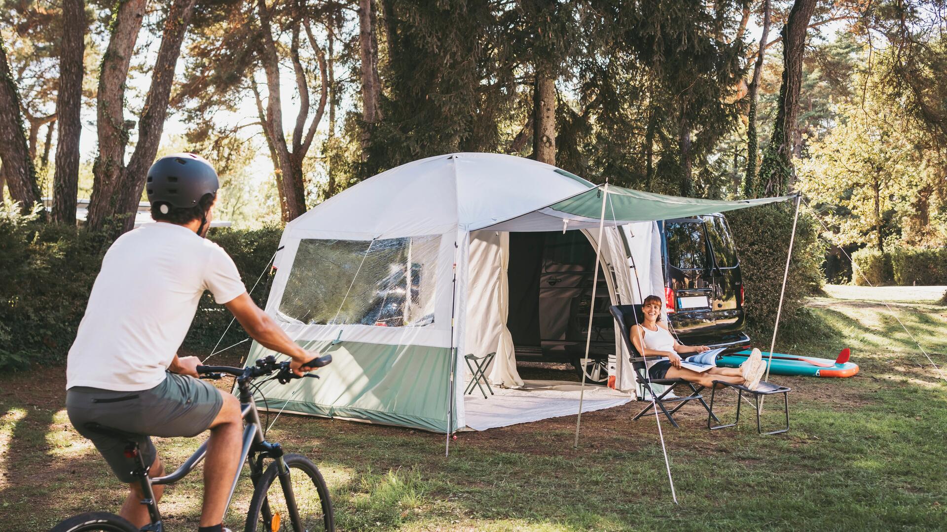 A family on a nature hike picks up trash