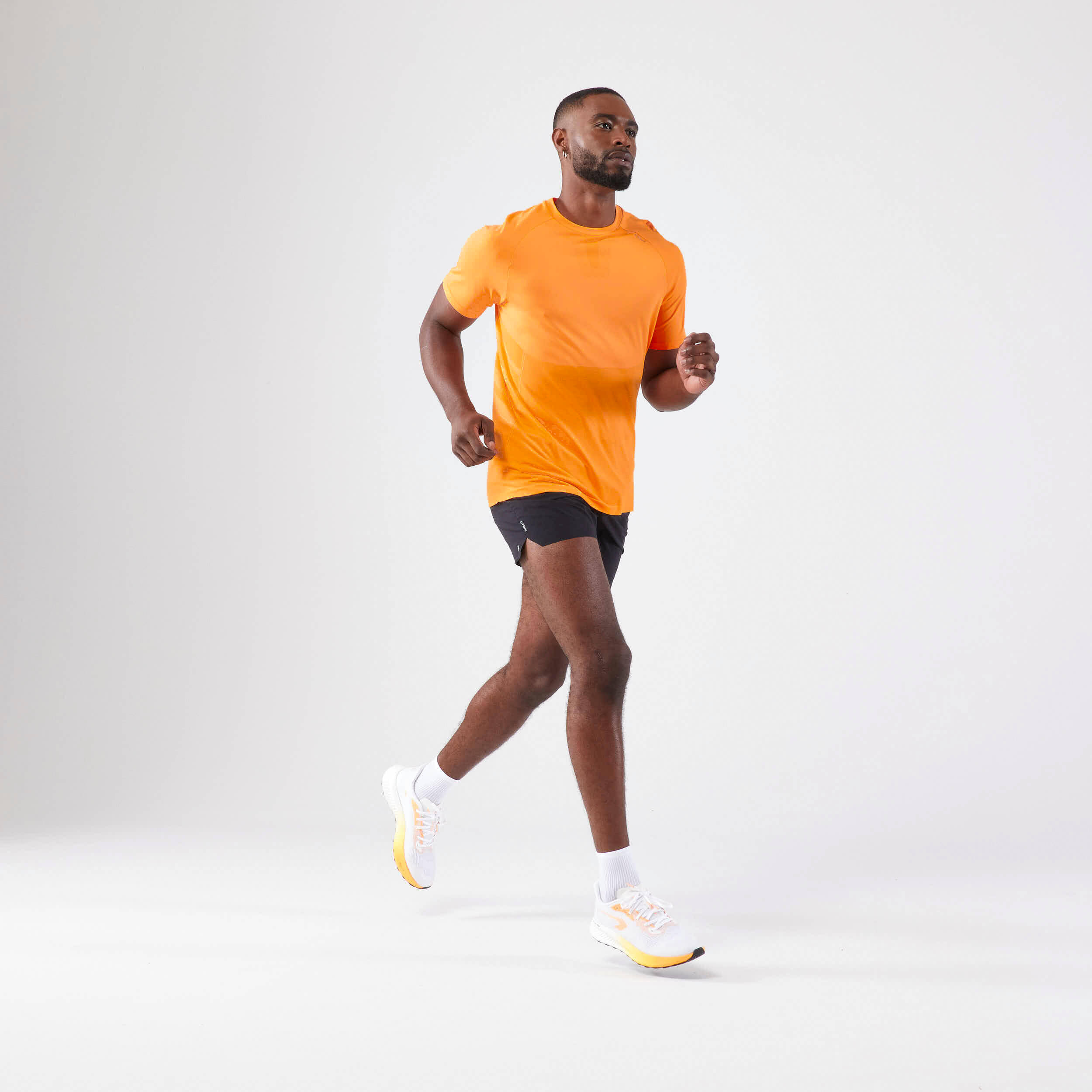 Men's KIPRUN Run 500 Comfort seamless running T-shirt - light orange -  2