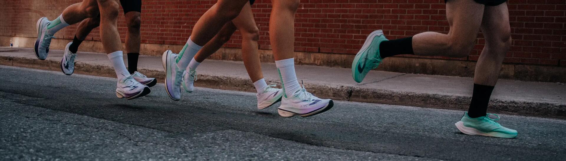 People standing with Running Shoes on