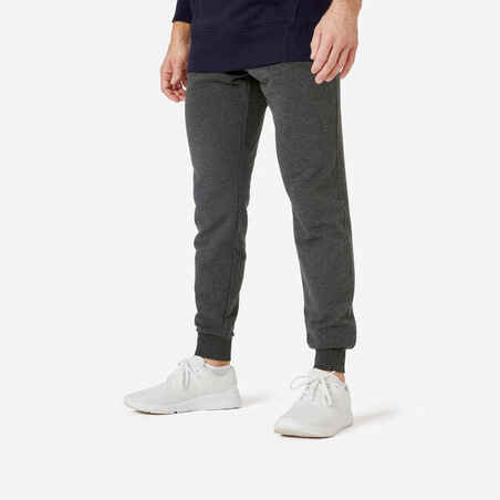 Pantalón deportivo de fitness de corte slim gris oscuro para hombre 500