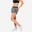 Pantaloncini donna palestra 100 oversize traspiranti nero-bianco