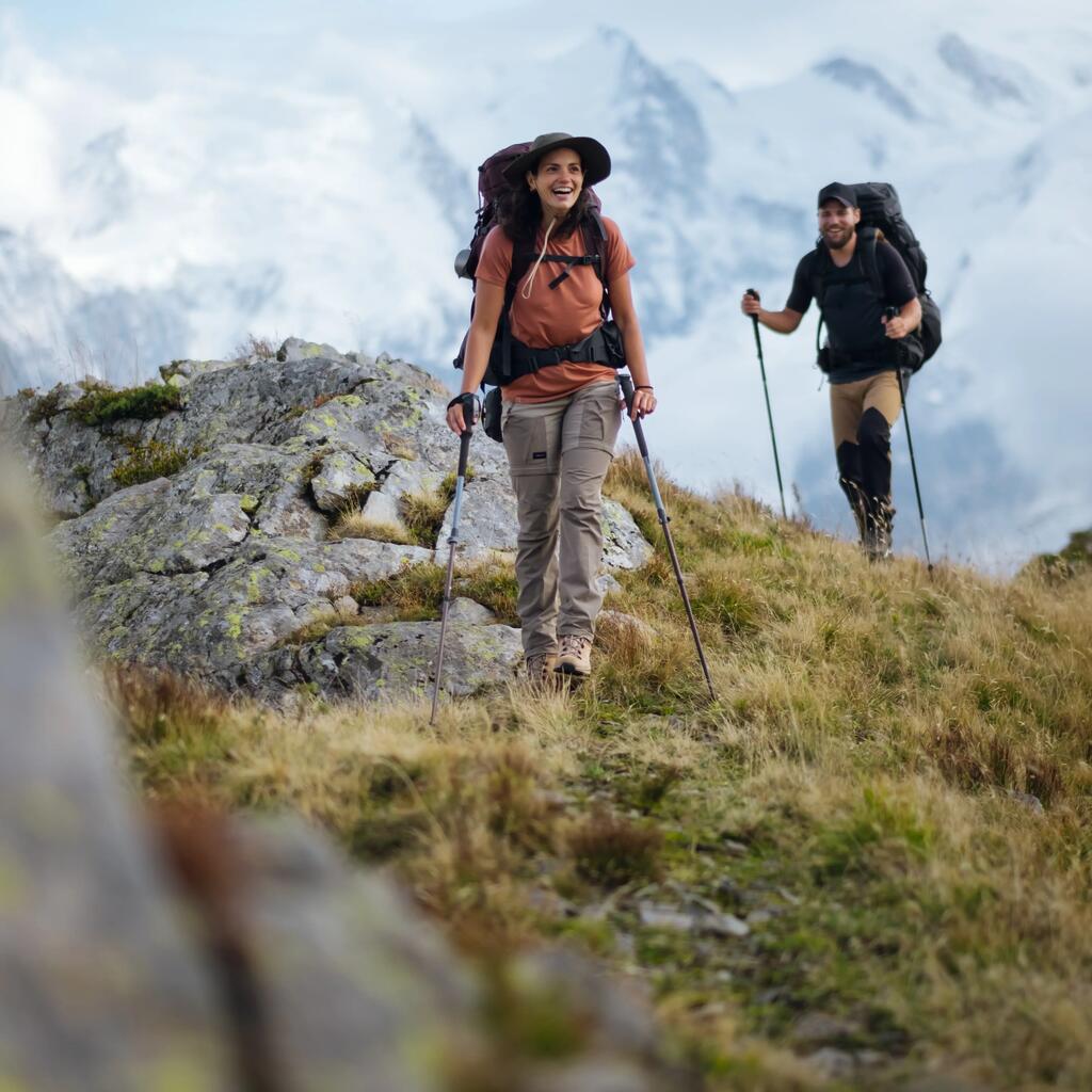 MAJICA ZA TREKING MT900 ŽENSKA KRATKIH RUKAVA BEŠAVNA OD MERINO VUNE - BRESKVA