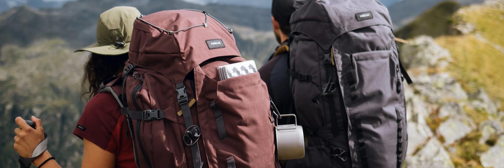 women-carrying-hiking-bag-8559694