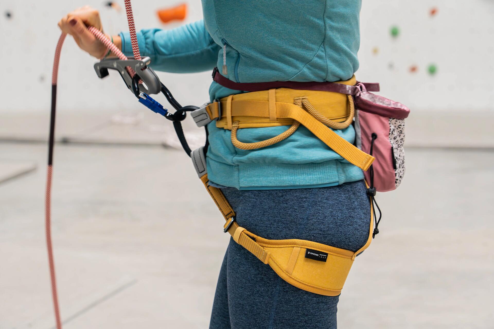 A close-up of a lady wearing a yellow Climbing Harness?