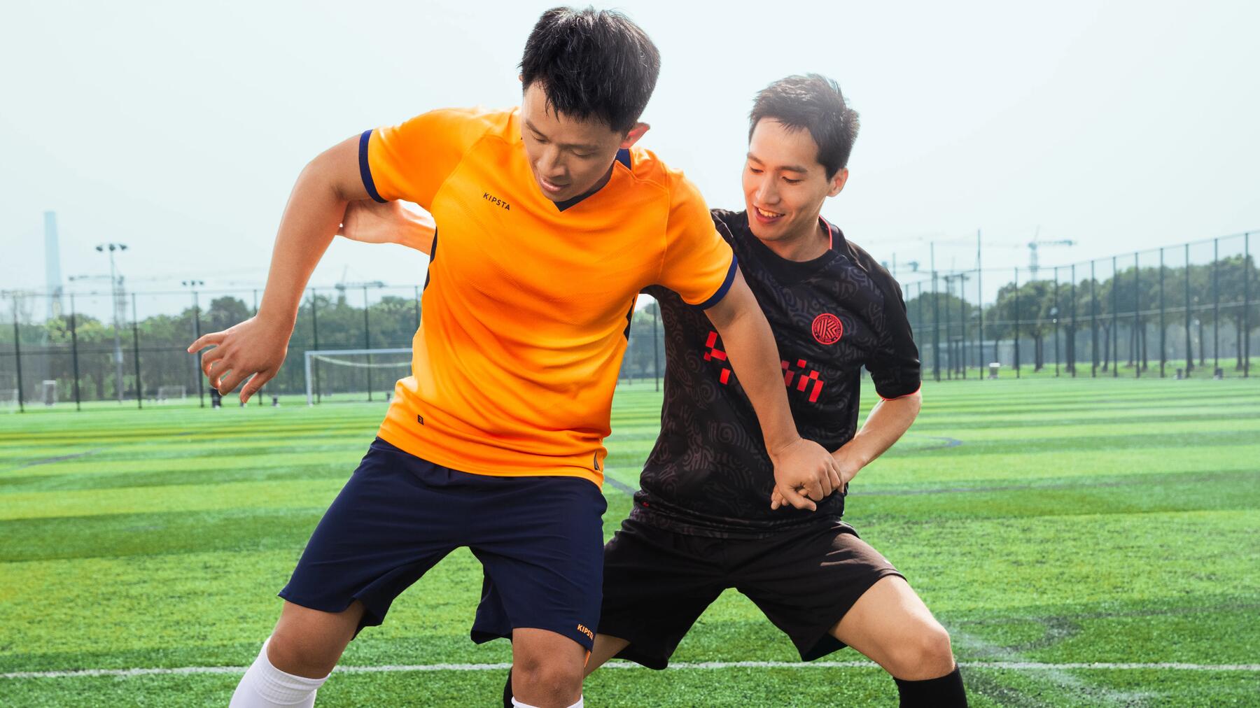 woman putting on her soccer jersey