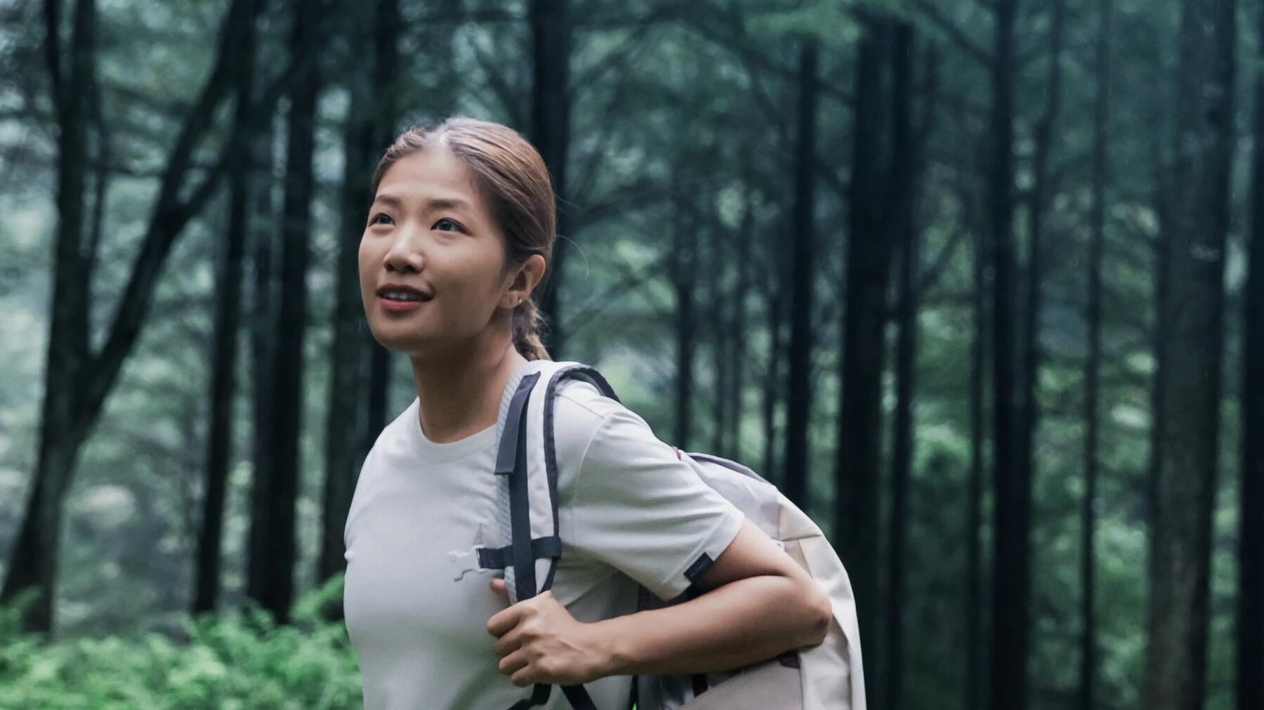 couple walking in the mountains with a sunset
