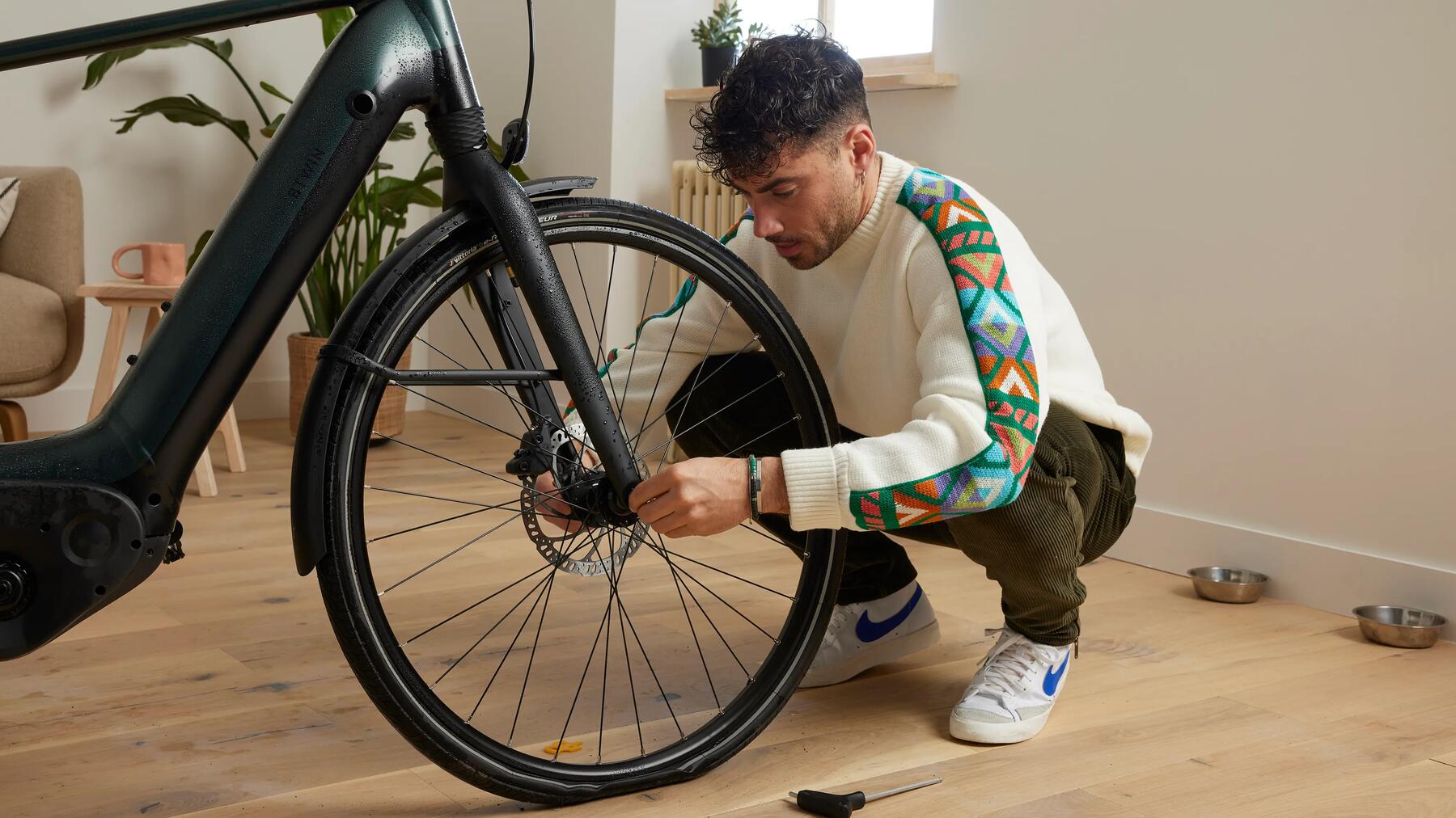 Man changing a bike tyre