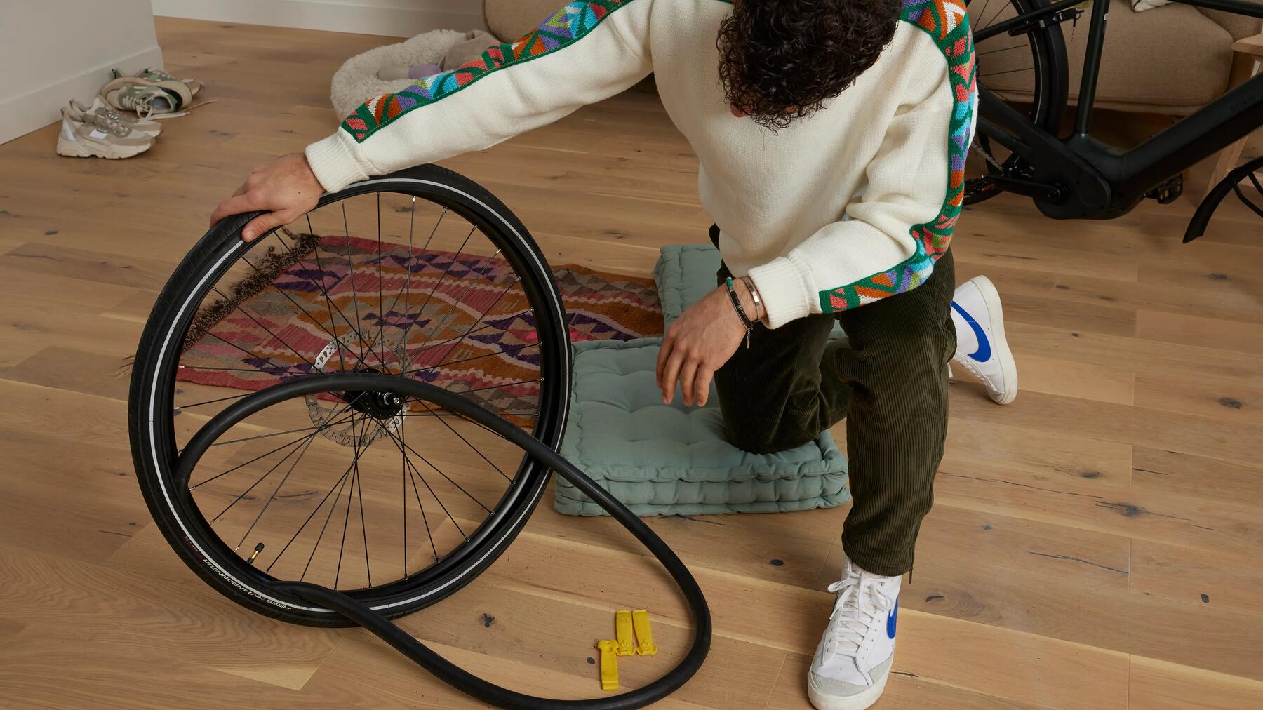 Man replacing a bike tyre and tube