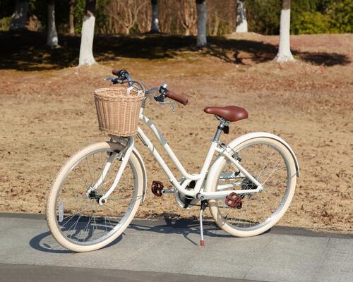White bike with a front wicker basket