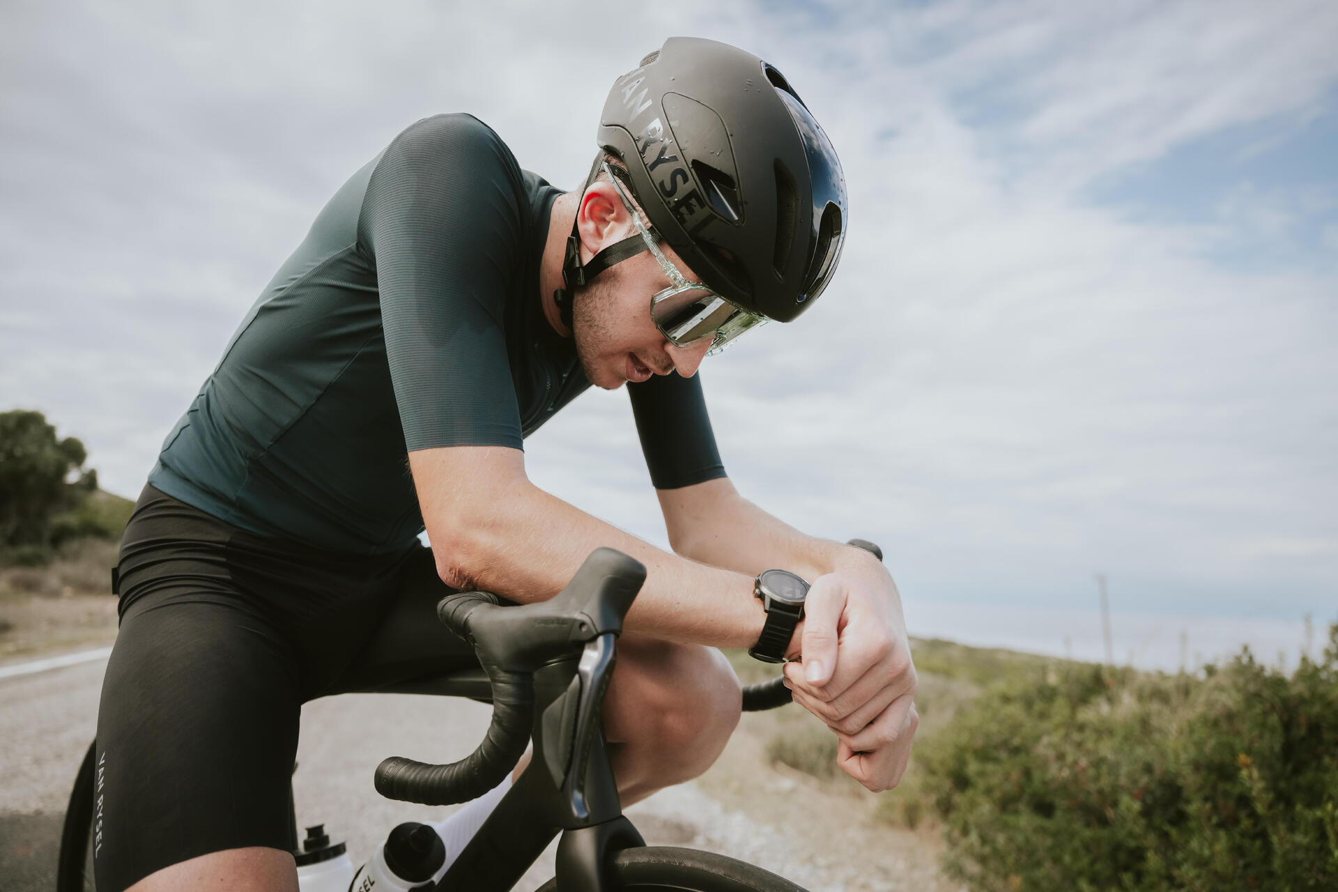 A  tired cyclist taking a break 