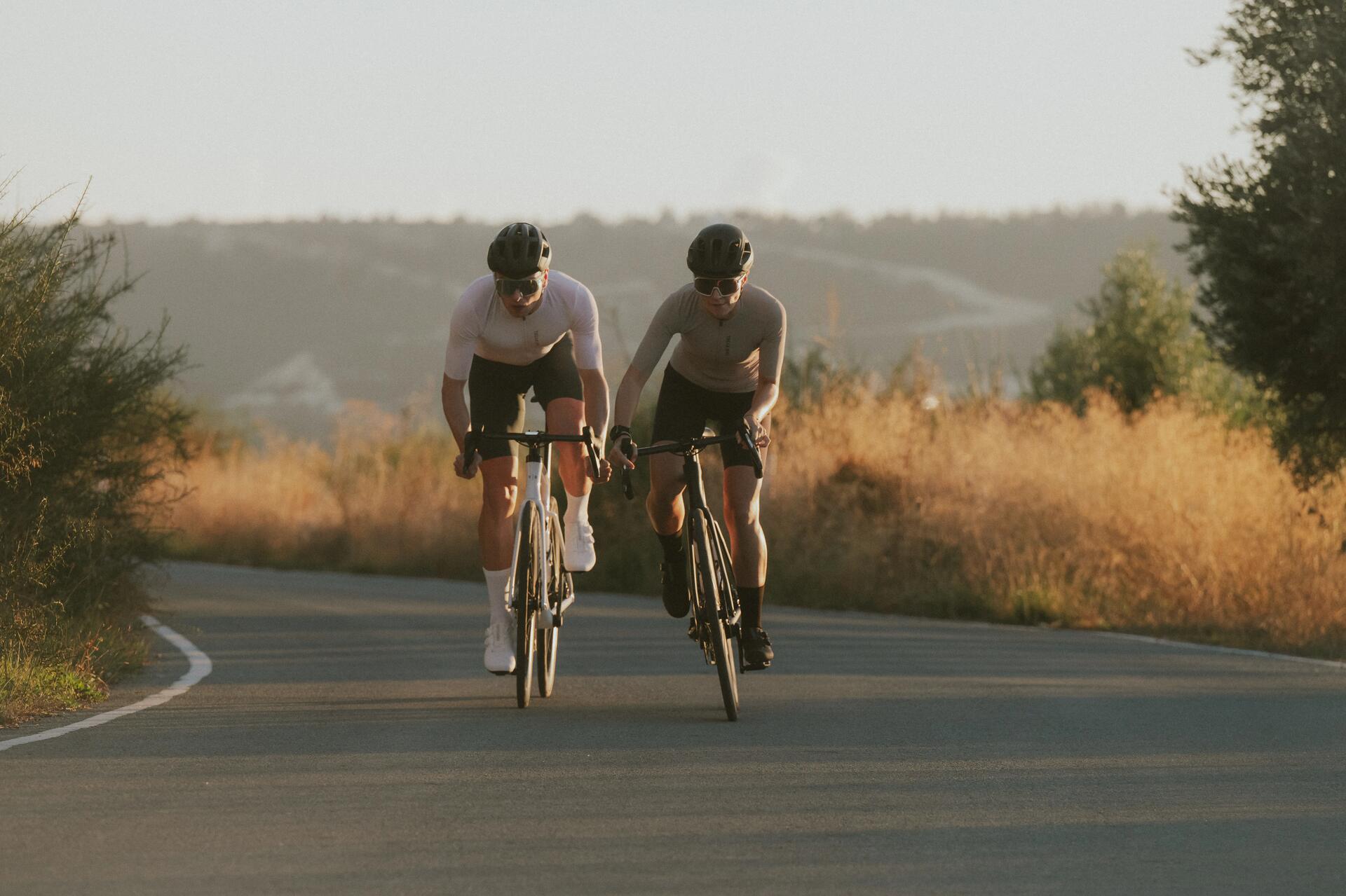 Two cyclists riding Van Rysel bikes