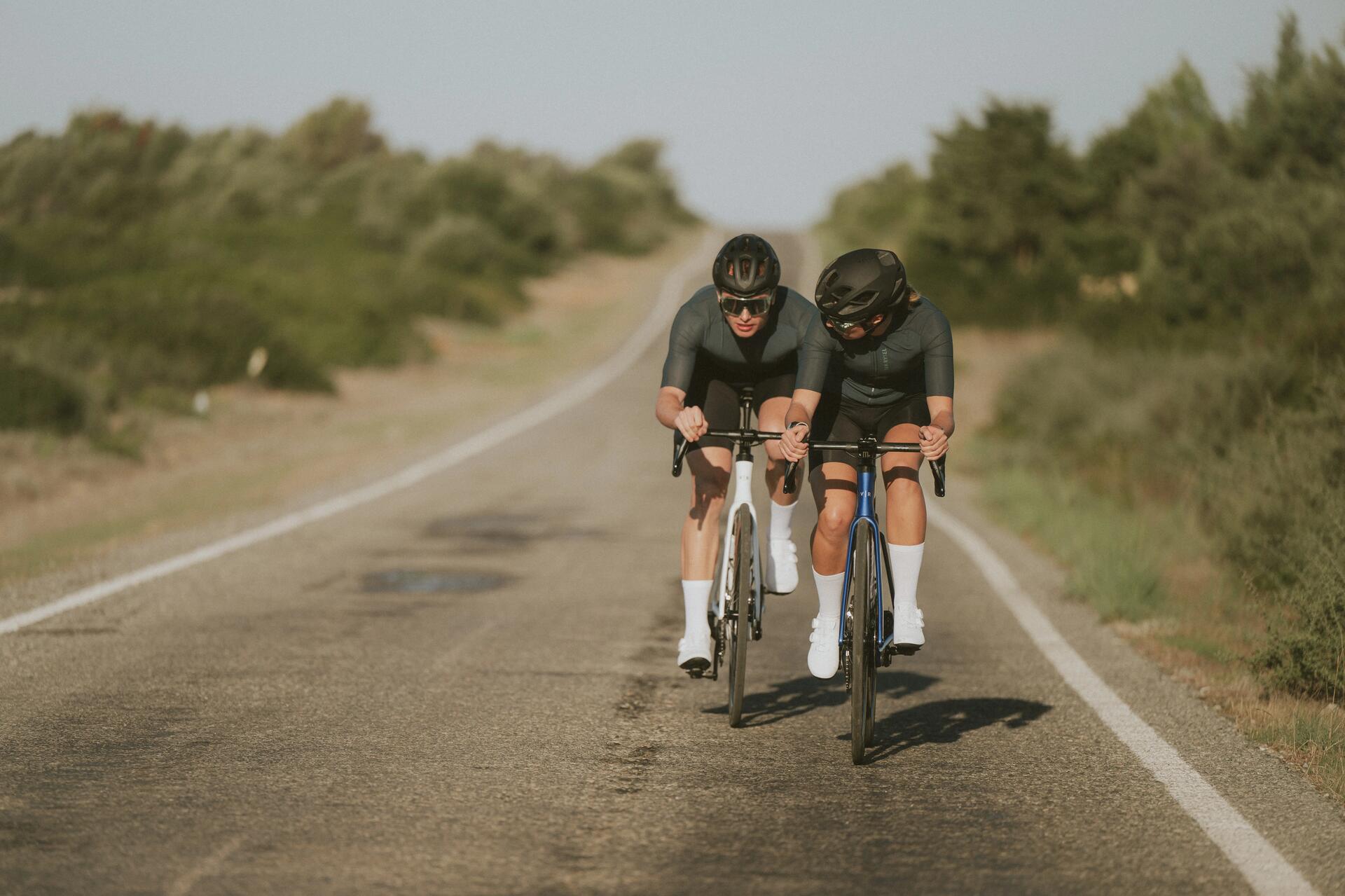 Two cyclists riding Van Rysel bikes