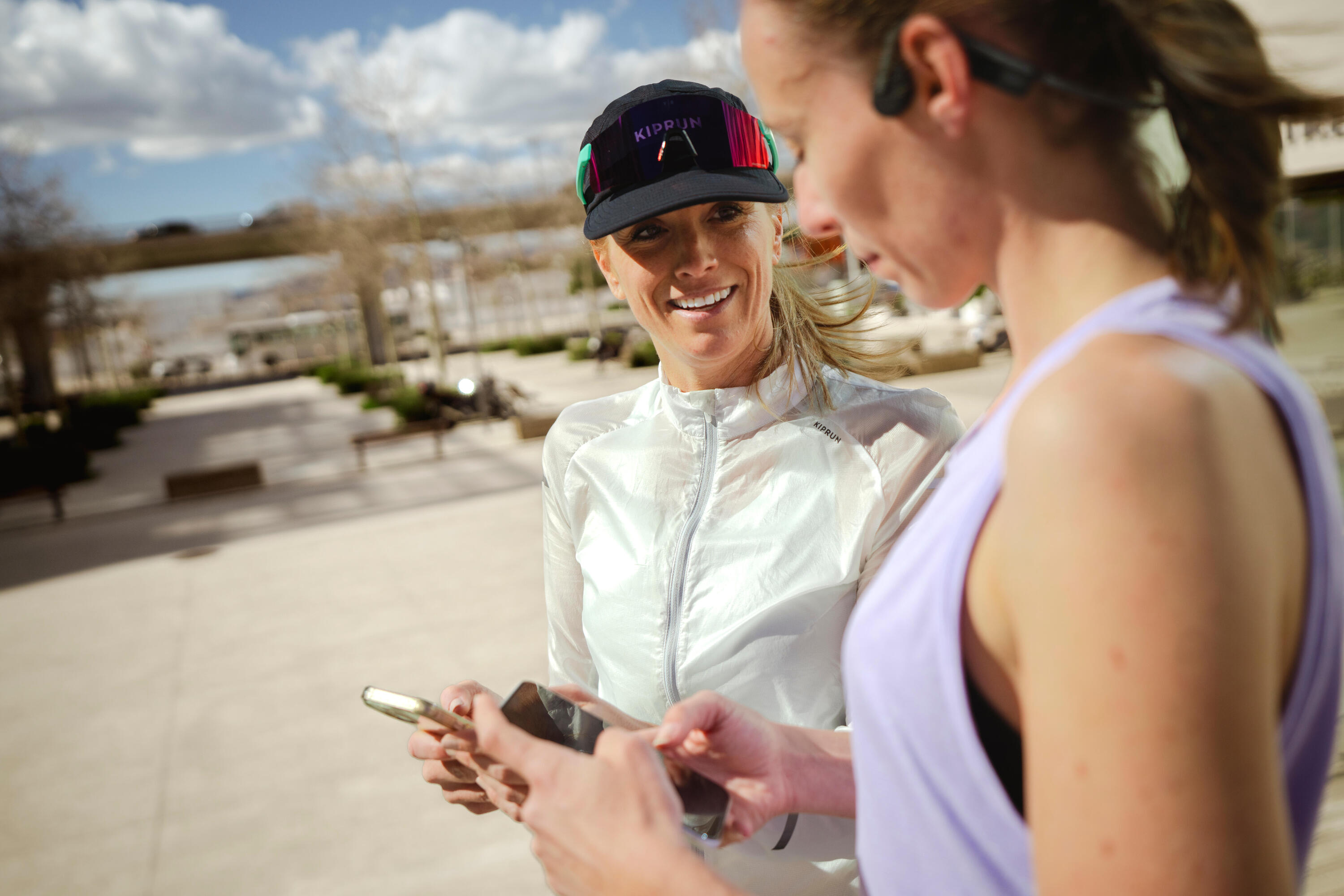  Two runners on their phones