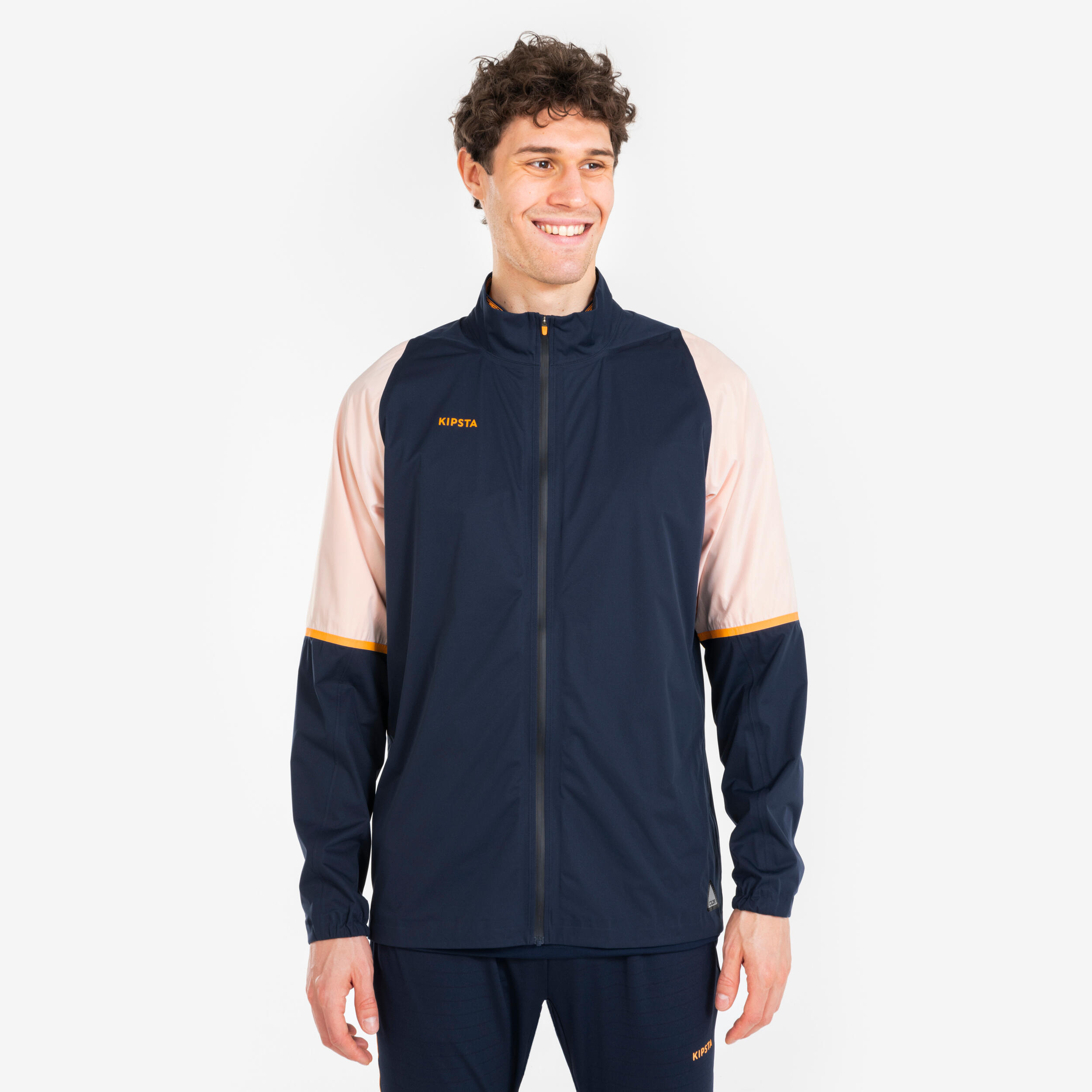 KIPSTA Regenjack voor voetbal voor volwassenen CLR marineblauw oranje