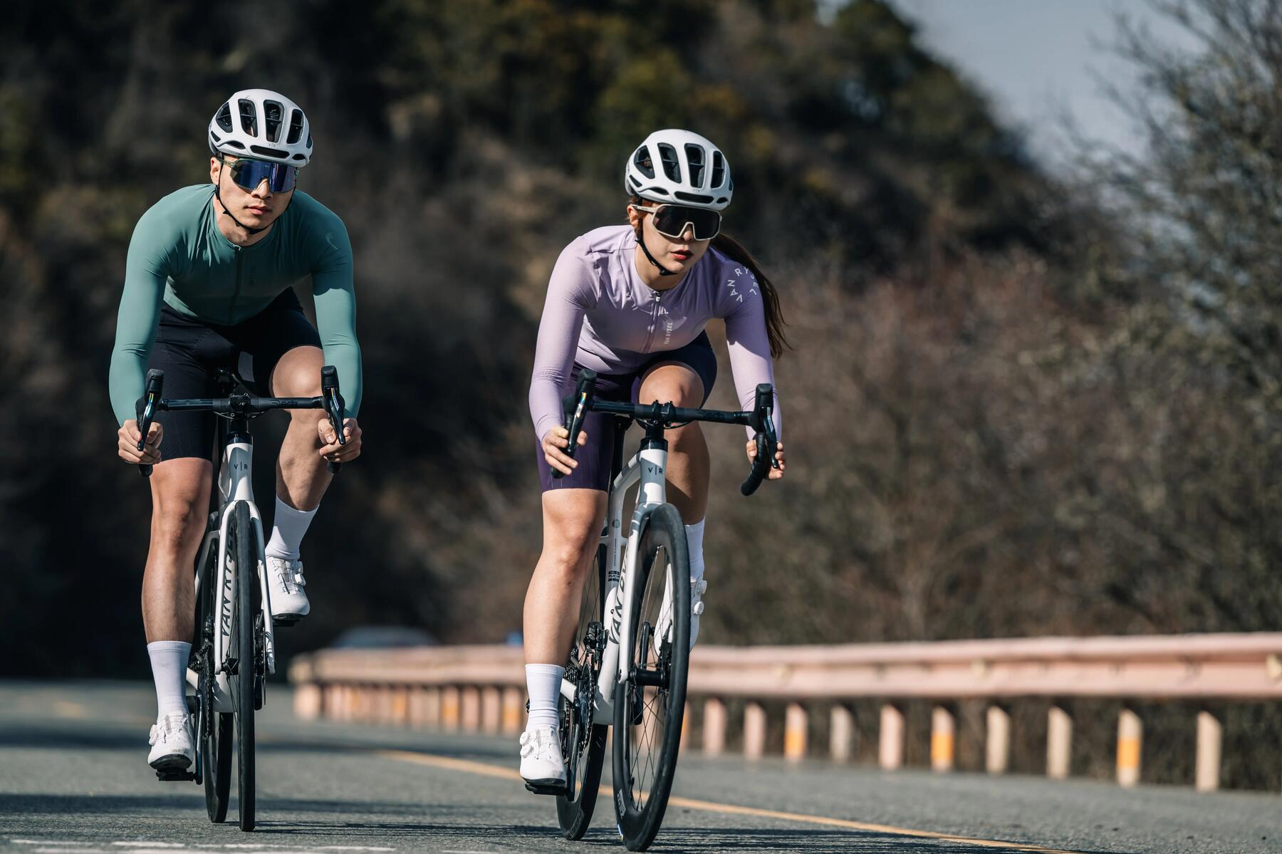Man and woman road cycling