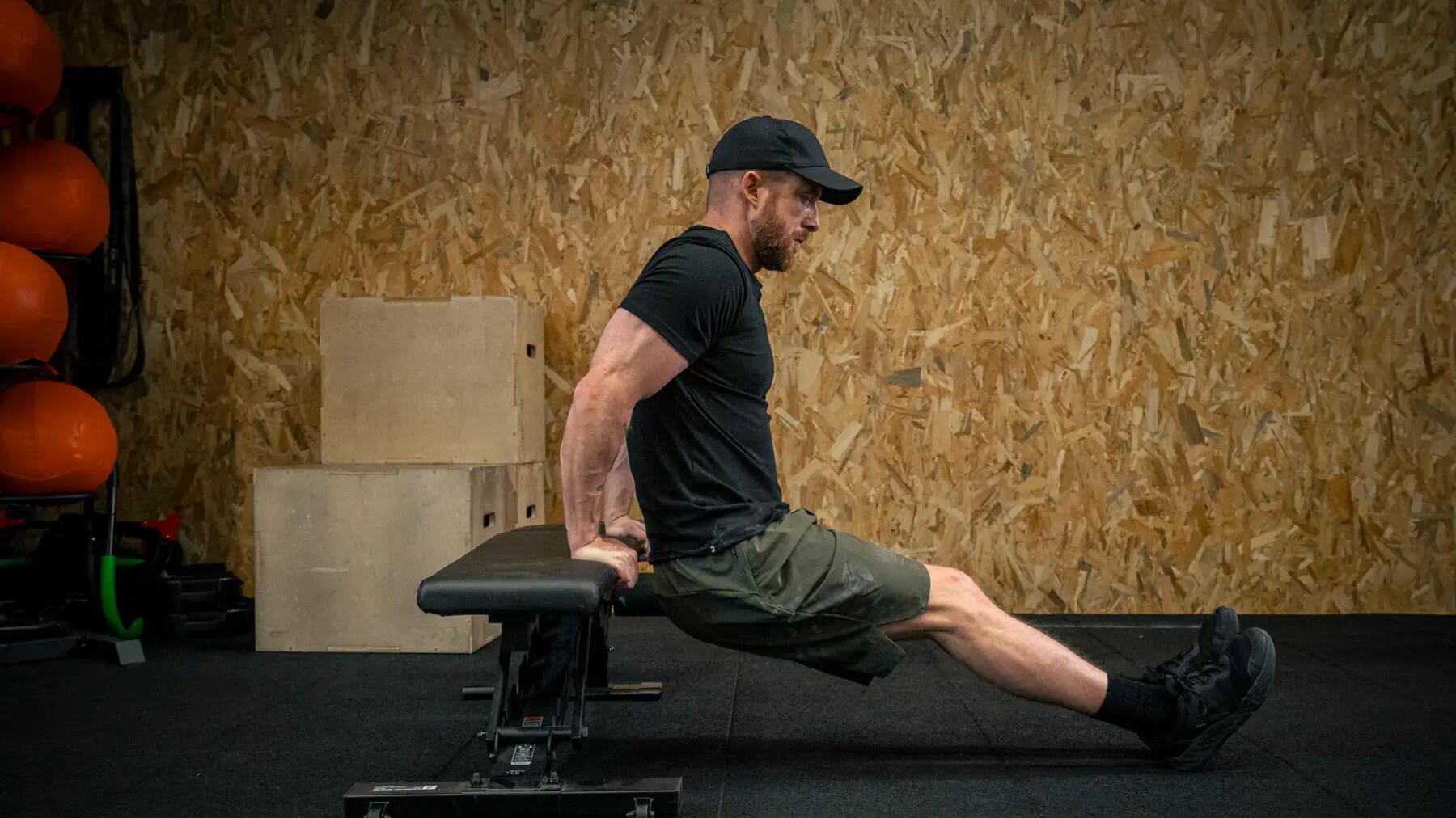 man doing dips on a lateral bar