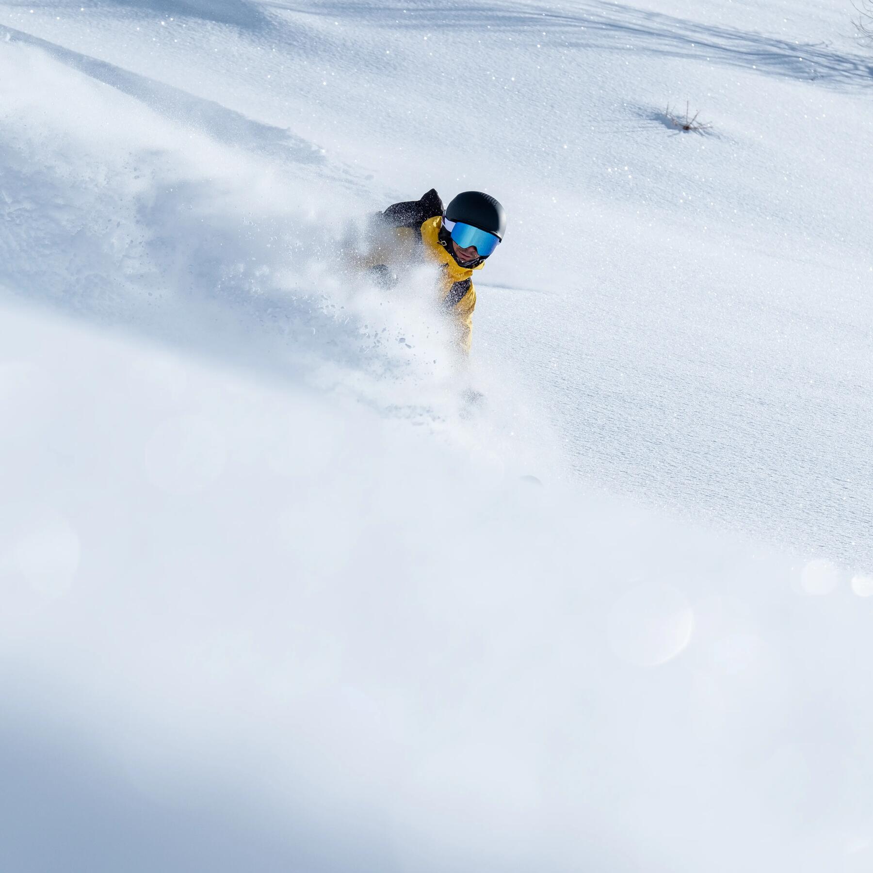 Decathlon men's freeride skiing outfit, yellow, powdery snow