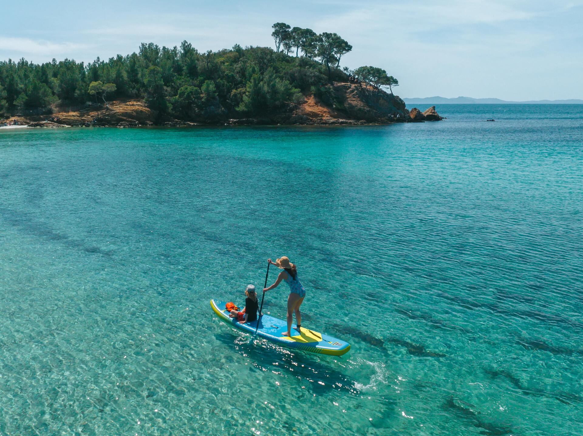 group of people practicing stand up paddle