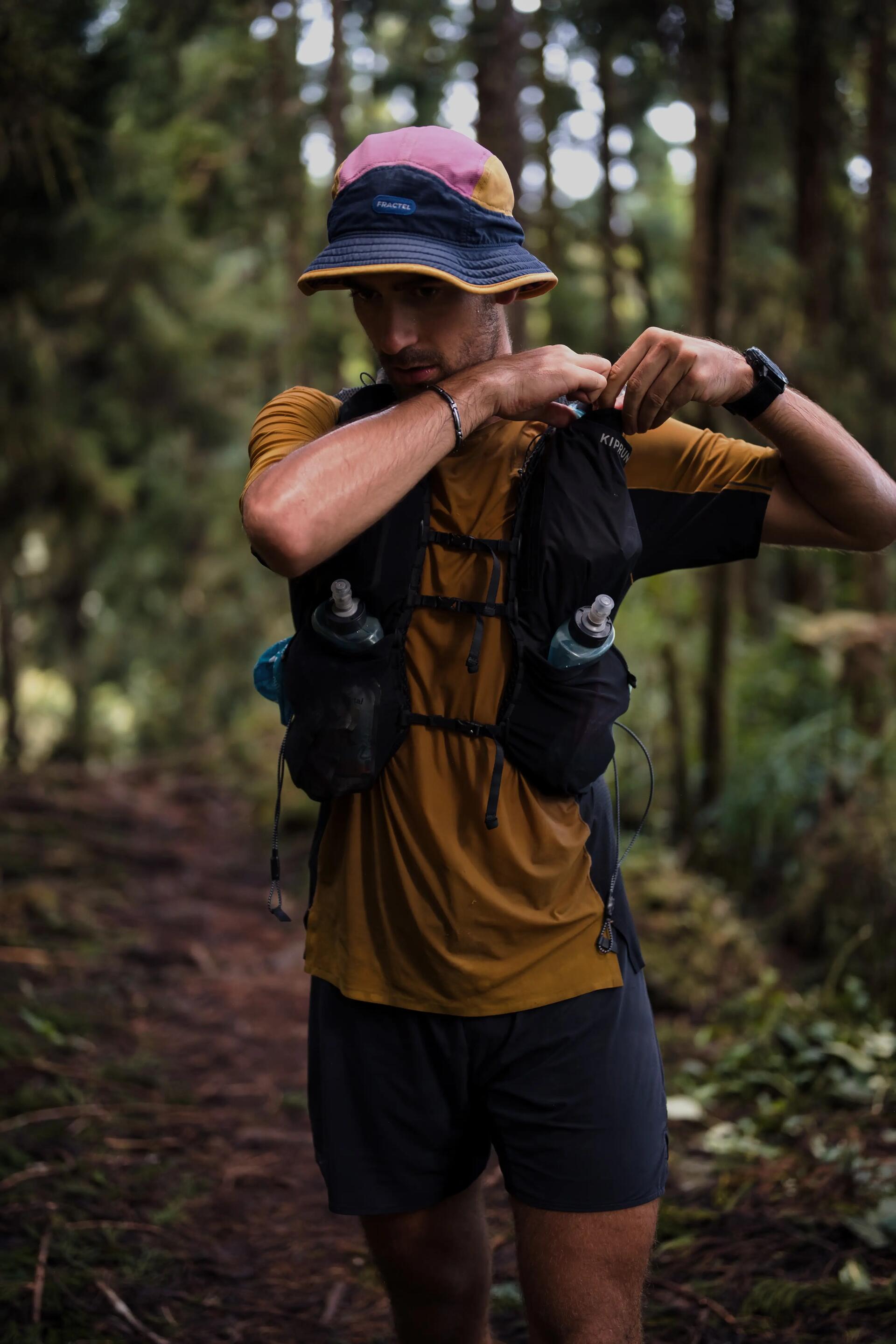 man drinking out of his hydration pack