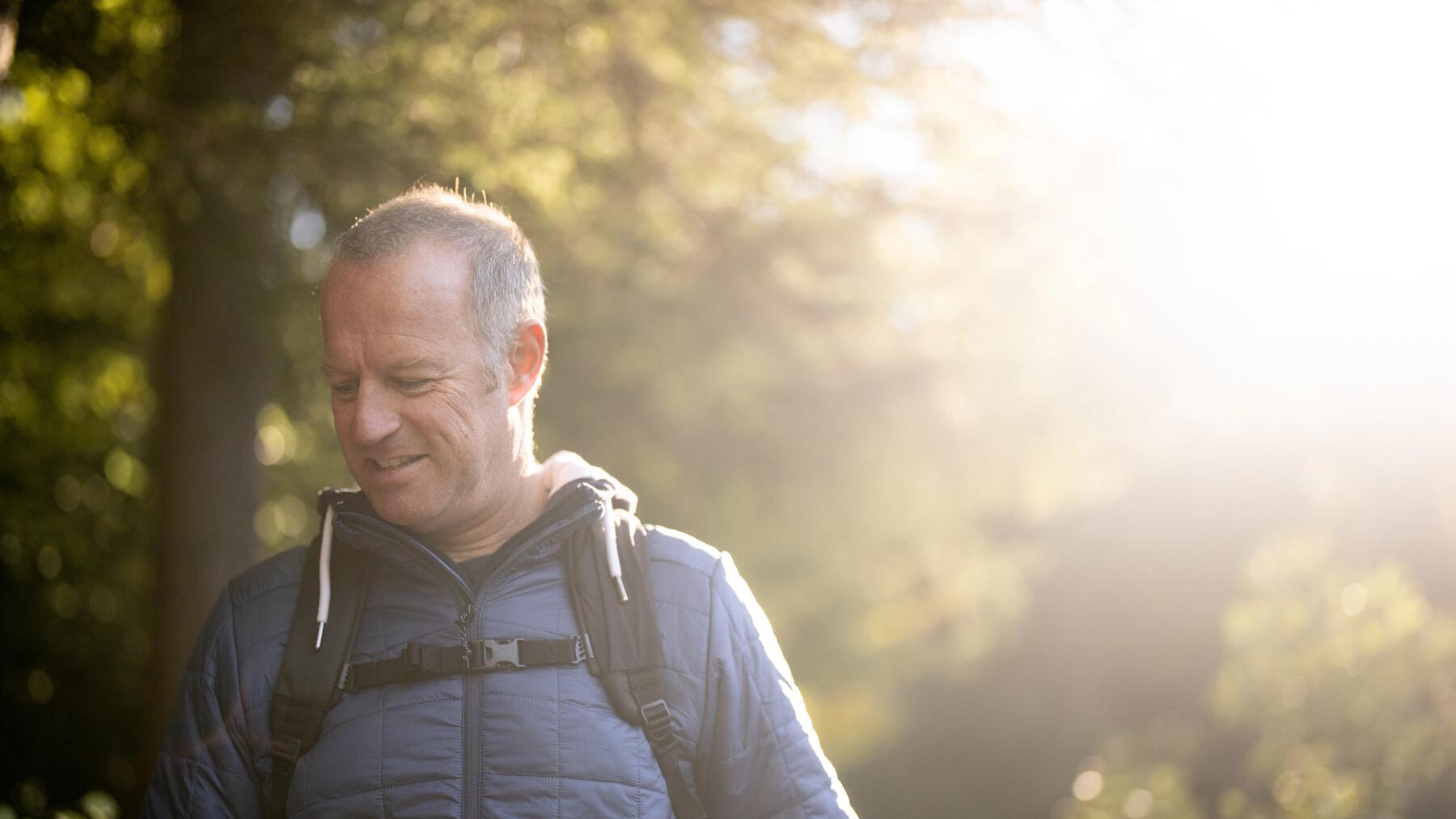 couple walking on the cliff overlooking the peninsula