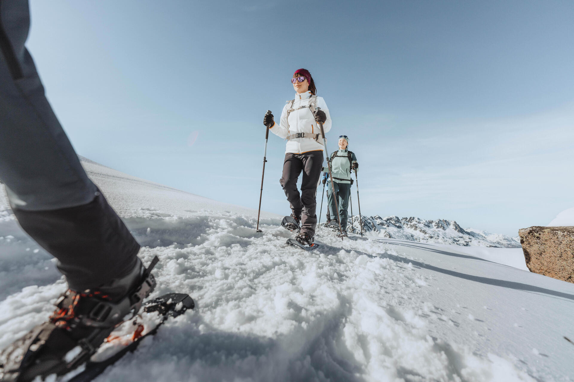 Two women on snowshoes contemplating nature