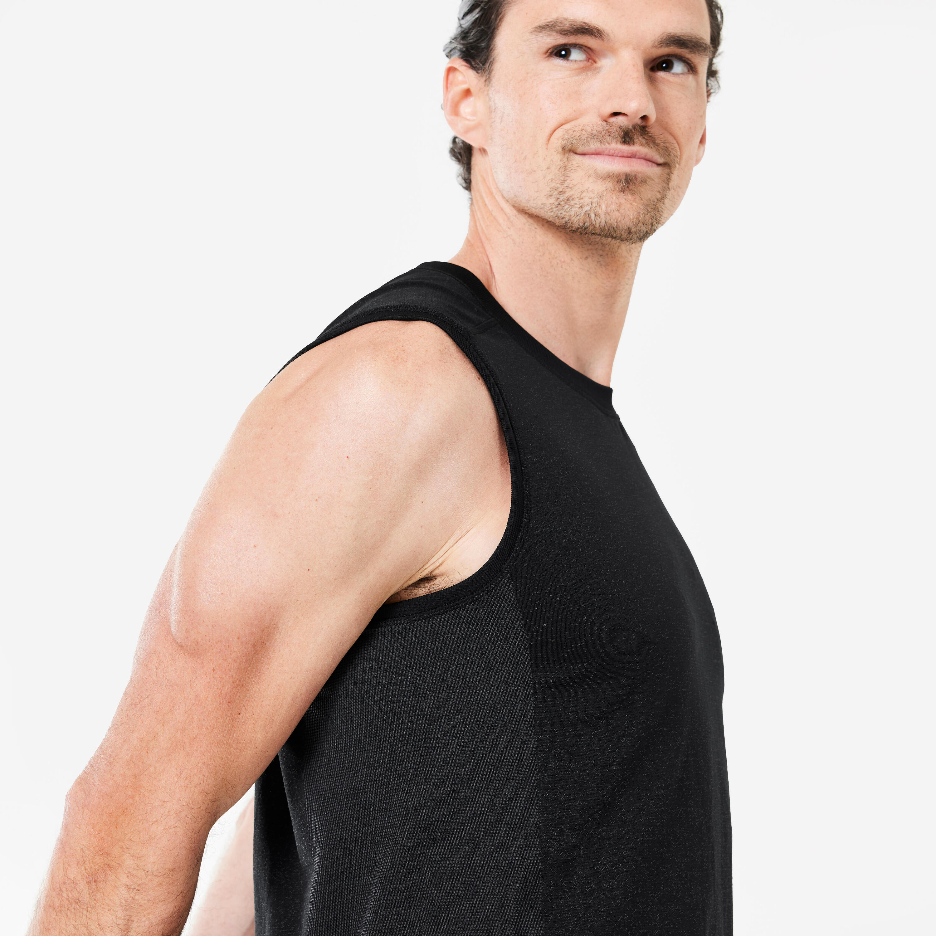 Naadloos en mouwloos shirt voor dynamische yoga heren zwart 5/6