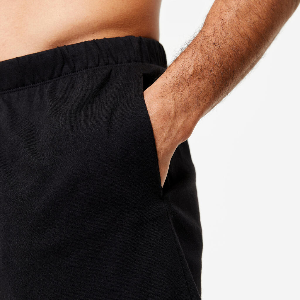 Pantaloneta de fitness con bolsillos para Hombre Domyos 100 negro