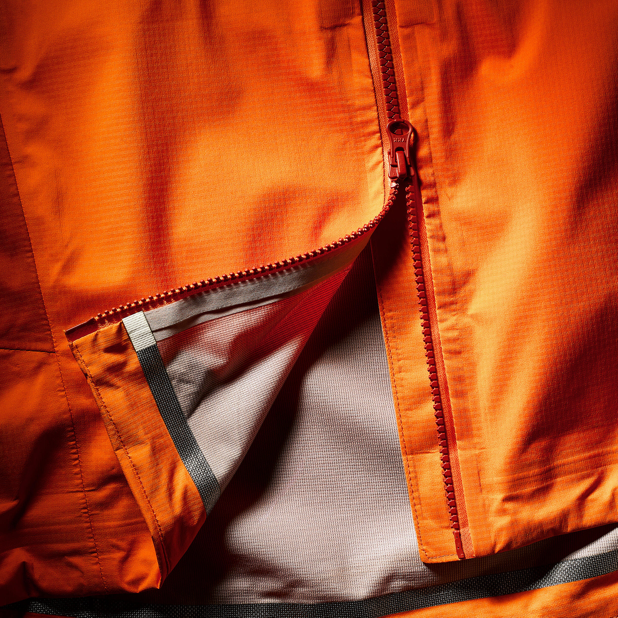 Waterproof mountaineering jacket MEN - ALPINISM LIGHT Orange