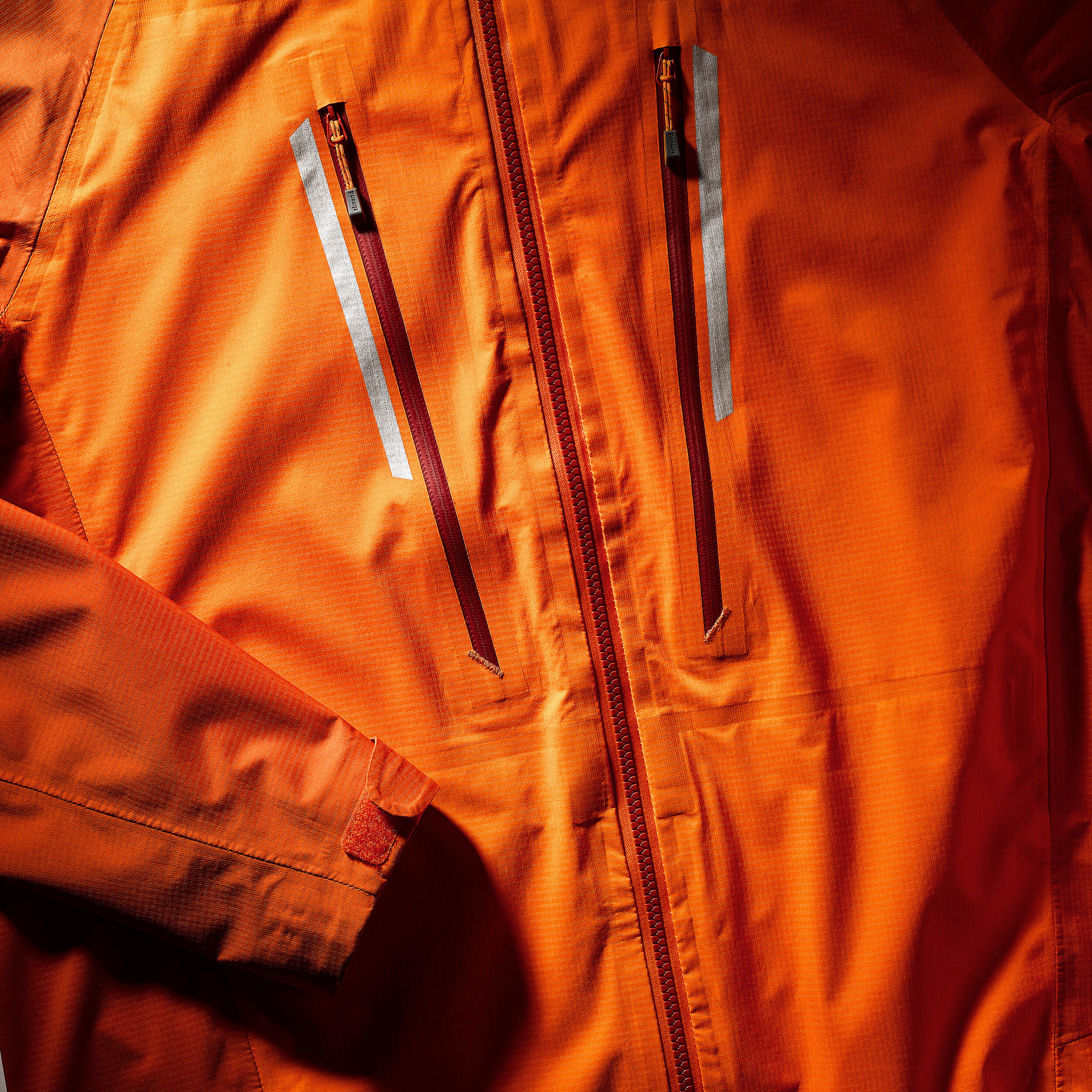 Waterproof mountaineering jacket MEN - ALPINISM LIGHT Orange