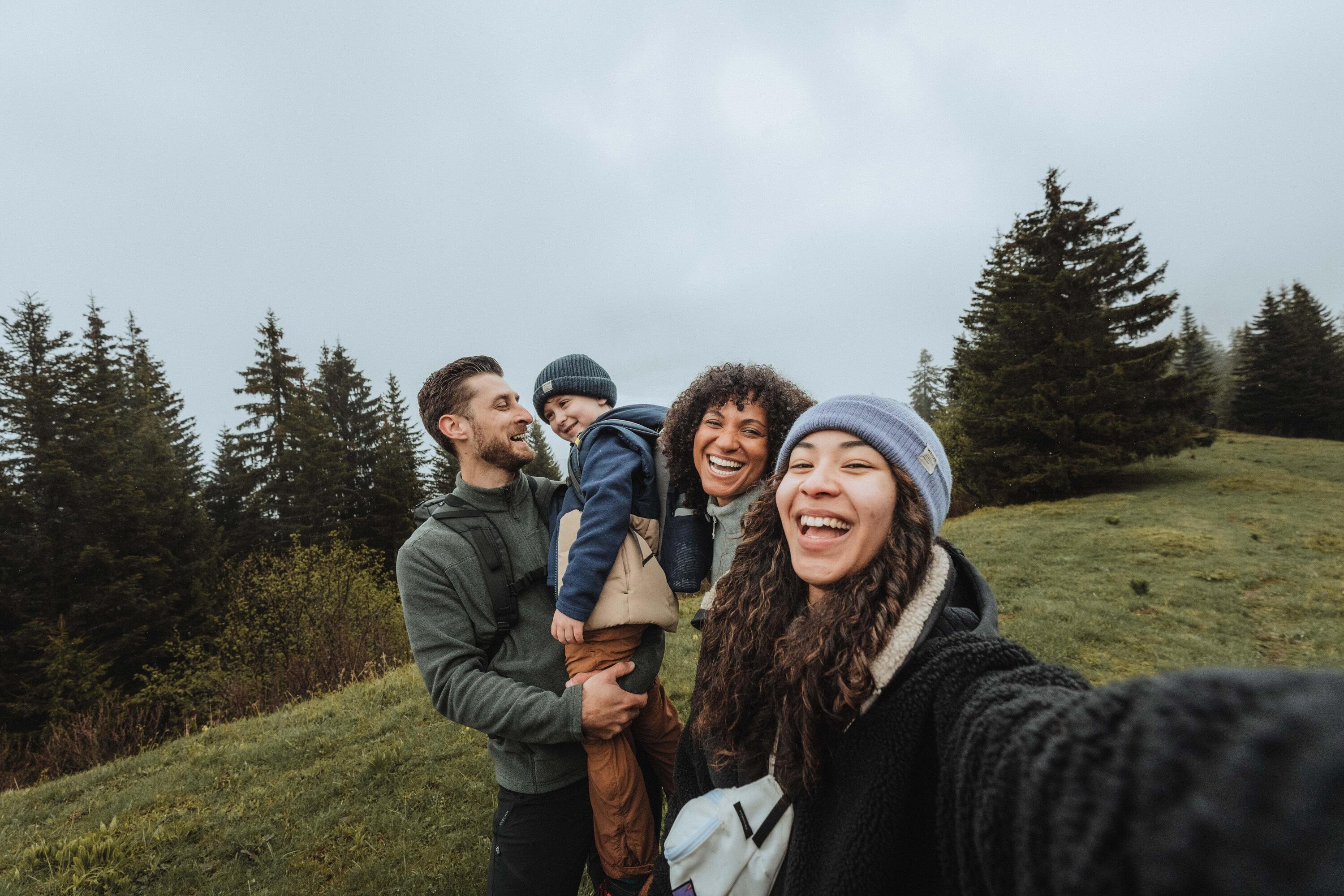 A family on a hike taking a selfie