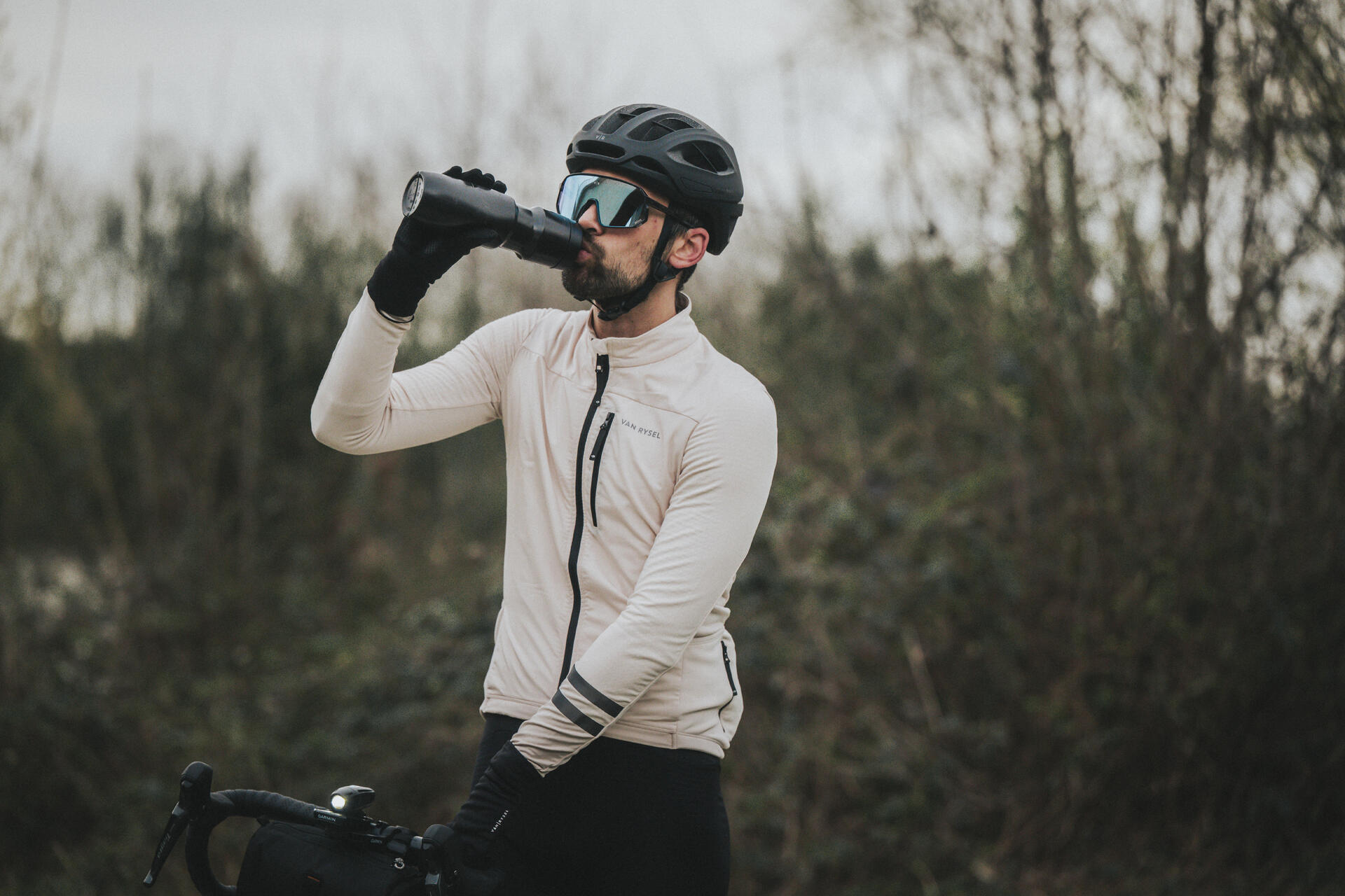Cyclist drinking from a water bottl