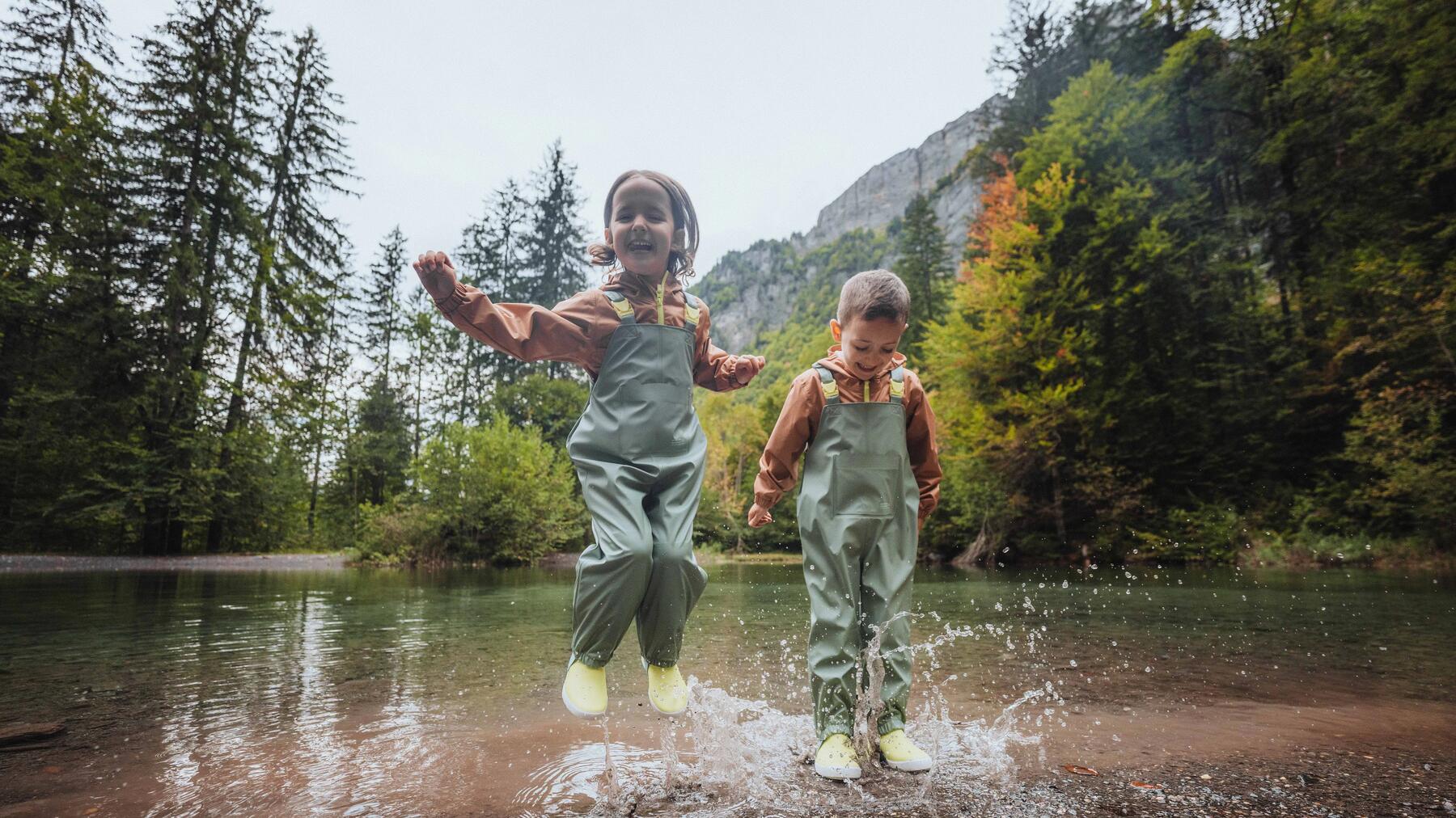 young child wearing a rain poncho