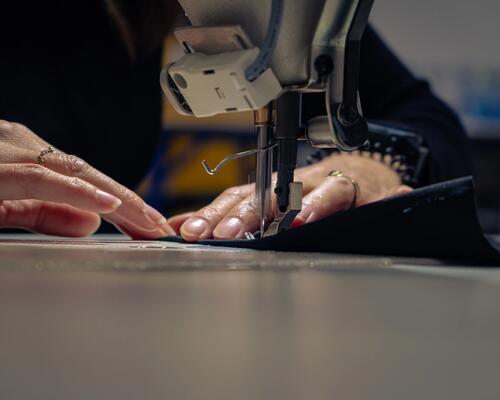 sewing machine repairing a jacket