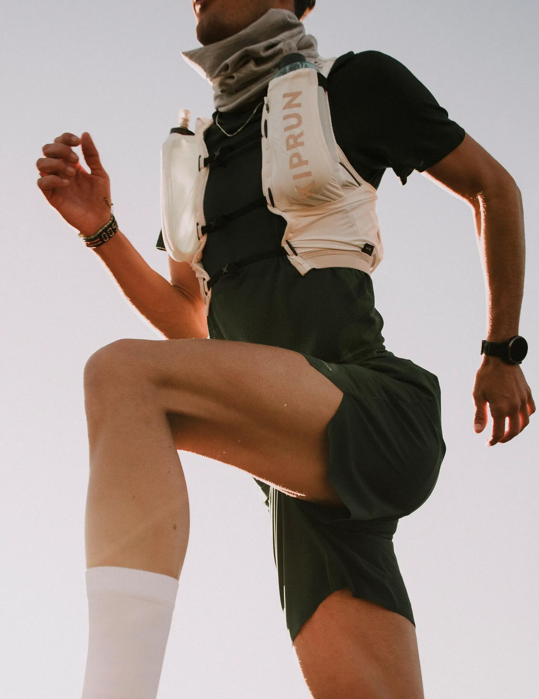 woman running with cap, sunglasses and hydration vest because of hot weather