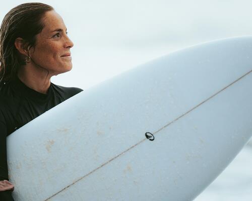 woman surfing the wave