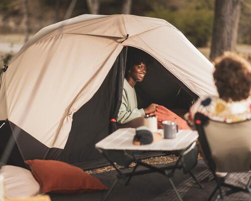 2 women camping and enjoying the quiet of nature