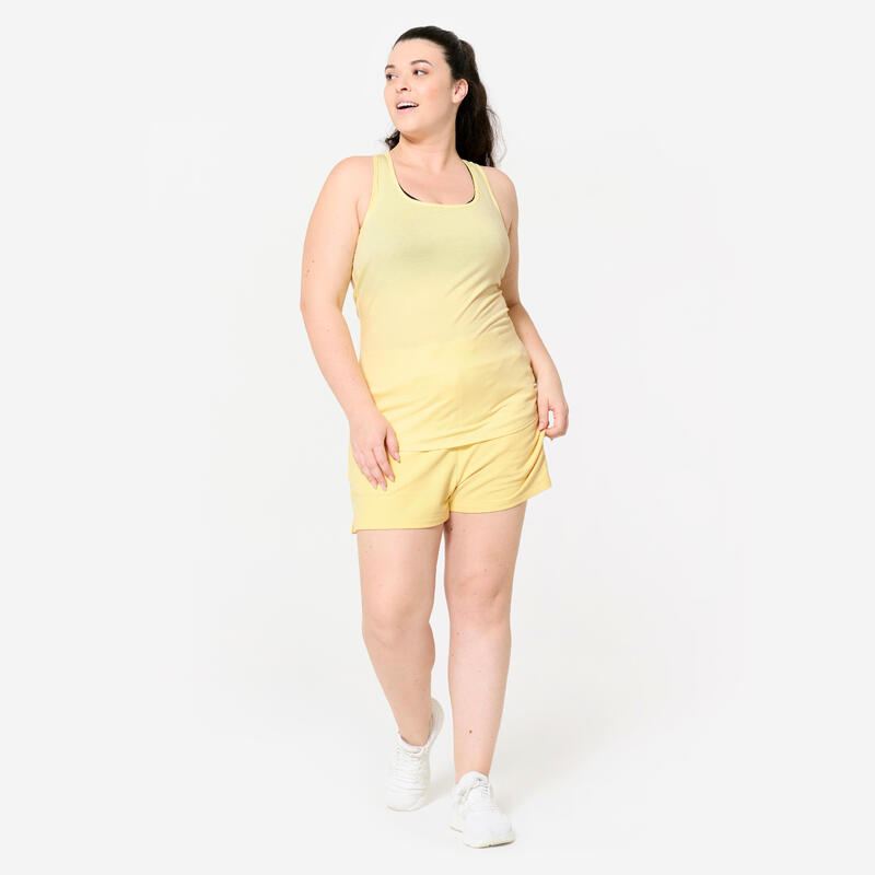 Débardeur slim col rond fitness femme, jaune pastel