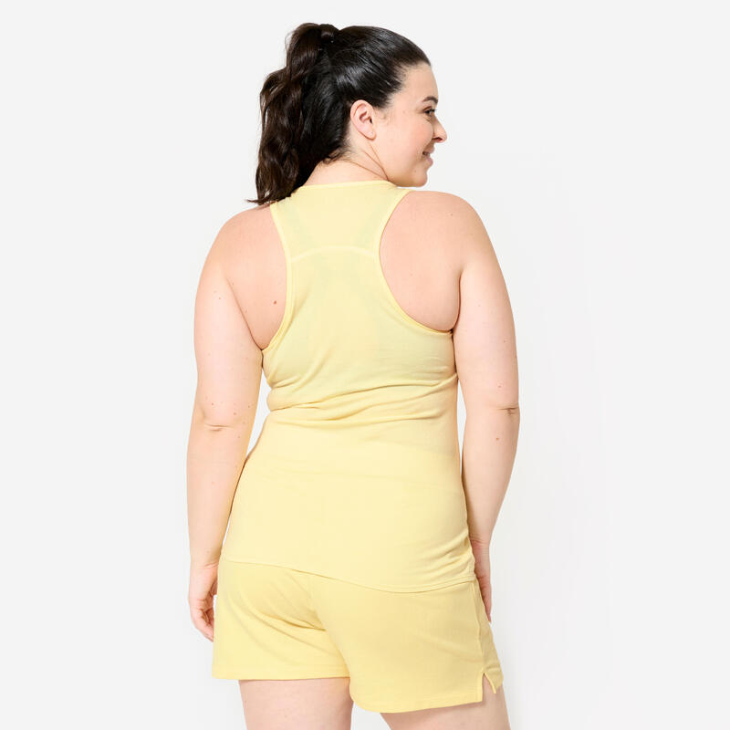 Débardeur slim col rond fitness femme, jaune pastel