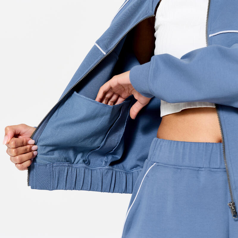 Veste bombers zipée femme, bleu avec piping blanc.