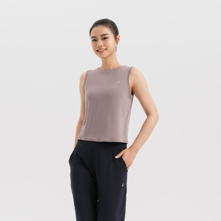 Women's sleeveless yoga tank top in frosted brown with black yoga trousers