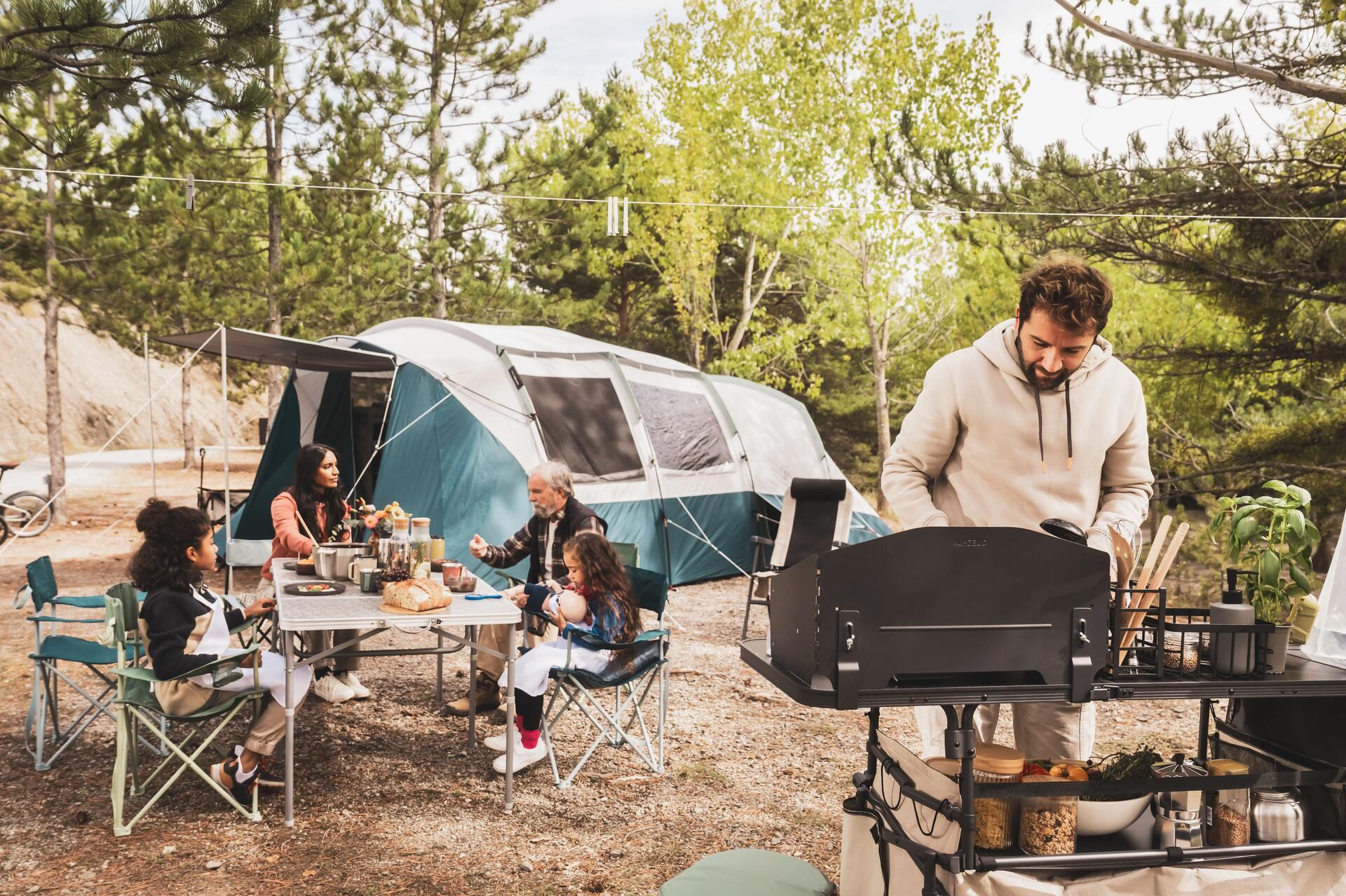 Two people set up their campsite in the Canadian Rockies