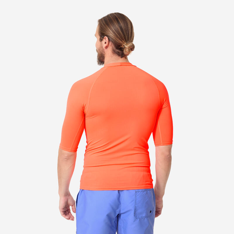 Uv-werende rashguard met korte mouwen voor heren 100 fluo-oranje