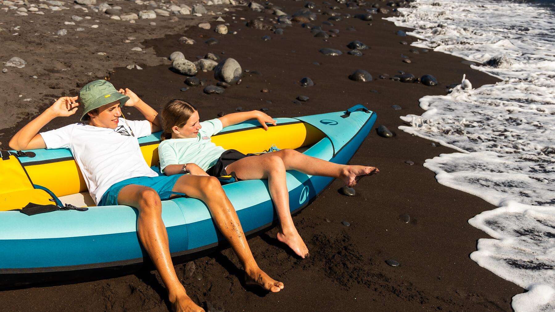 Two people paddling in a tandem kayak