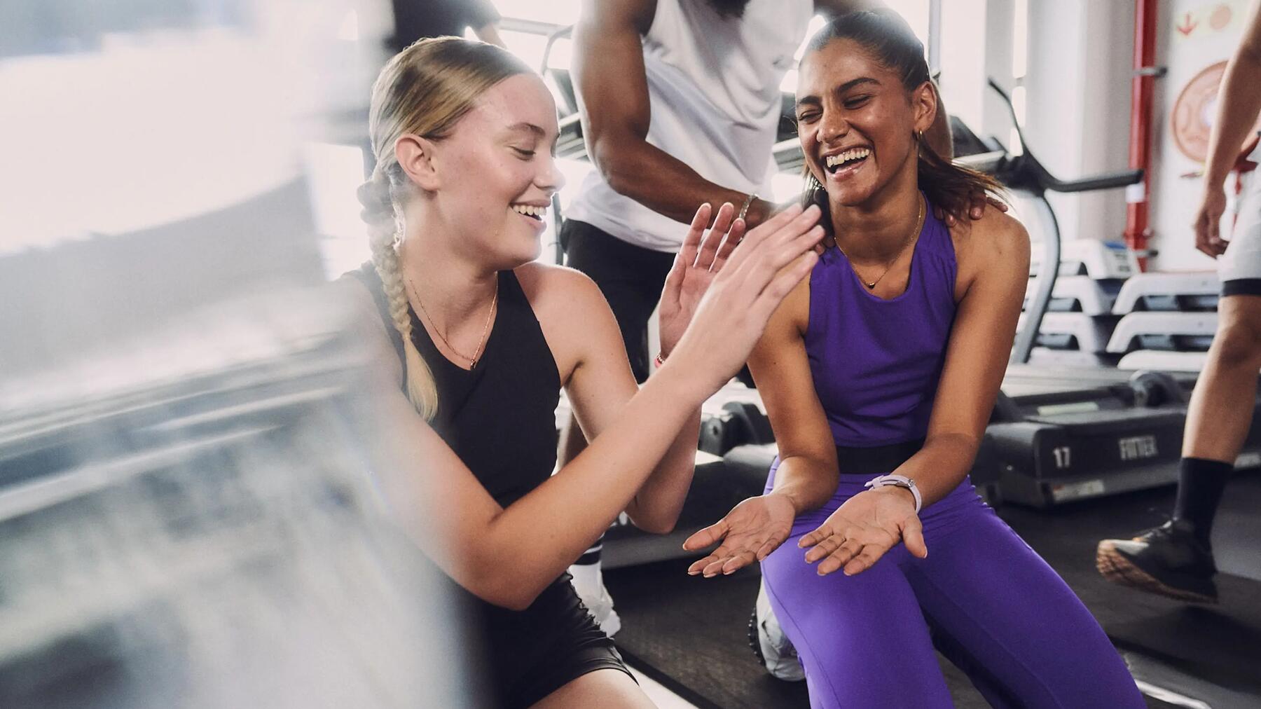 people in a Crossfit training group congratulating themselves